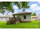 Green backyard view of home with wooden deck and ample space for outdoor activities at 92 E Spencer Mountain Ave, Gastonia, NC 28054
