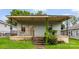 Charming home featuring a cozy front porch with decorative railings, perfect for relaxing outdoors at 92 E Spencer Mountain Ave, Gastonia, NC 28054