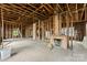 Spacious living room with exposed brick fireplace and an open layout ready for renovation at 92 E Spencer Mountain Ave, Gastonia, NC 28054