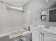 Bright bathroom showcasing a bathtub-shower combo, vanity sink, and ample lighting at 935 Church St, Kings Mountain, NC 28086