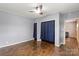 Spacious bedroom with hardwood floors, ample closet space, and a ceiling fan for added comfort at 935 Church St, Kings Mountain, NC 28086