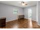 Bedroom featuring hardwood floors, soft gray walls, and modern furniture at 935 Church St, Kings Mountain, NC 28086
