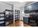 Functional kitchen with stainless steel appliances, blue cabinets, and exterior door access at 935 Church St, Kings Mountain, NC 28086