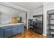 Open kitchen featuring stainless steel refrigerator, blue cabinets and butcher block countertops at 935 Church St, Kings Mountain, NC 28086