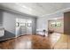 Dining area with hardwood floors next to an open living room area with bright natural light at 935 Church St, Kings Mountain, NC 28086