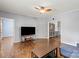 Bright living room featuring hardwood floors, ceiling fan, gray walls and connections to other rooms at 935 Church St, Kings Mountain, NC 28086