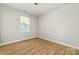 Well-lit bedroom with a large window and modern, neutral color palette at 9630 Turning Wheel Dr, Charlotte, NC 28214