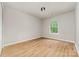 Neutral bedroom with large window providing natural light and new luxury vinyl flooring at 9630 Turning Wheel Dr, Charlotte, NC 28214