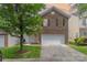 Charming two-story brick home with well-maintained lawn, two-car garage, and inviting curb appeal at 9630 Turning Wheel Dr, Charlotte, NC 28214