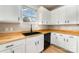 Bright kitchen features white cabinets, wooden countertops, and modern black hardware at 9630 Turning Wheel Dr, Charlotte, NC 28214