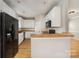 Bright kitchen with stainless steel appliances and wood floors at 9630 Turning Wheel Dr, Charlotte, NC 28214