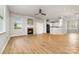 Open living area featuring a fireplace and seamless access to the kitchen at 9630 Turning Wheel Dr, Charlotte, NC 28214