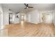 Spacious living area with wood floors leading to the kitchen at 9630 Turning Wheel Dr, Charlotte, NC 28214