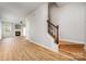Open floorplan featuring luxury vinyl flooring leading to an electric fireplace at 9630 Turning Wheel Dr, Charlotte, NC 28214