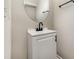 Simple powder room with round mirror and modern fixtures at 9630 Turning Wheel Dr, Charlotte, NC 28214