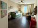 Bright bedroom featuring a daybed, dark floors, and modern decor at 11324 Fullerton Place Nw Dr, Huntersville, NC 28078