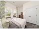 Bedroom with a dresser, window, and closet at 11324 Fullerton Place Nw Dr, Huntersville, NC 28078