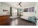 Bedroom featuring ceiling fan, dresser, natural light, and unique wall decorations at 11324 Fullerton Place Nw Dr, Huntersville, NC 28078