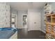 Bright bedroom featuring dark wood floors, white trim, closet and Star Wars wallpaper at 11324 Fullerton Place Nw Dr, Huntersville, NC 28078