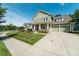 Attractive two-story home with a classic front porch, lush green lawn, and convenient two-car garage at 11324 Fullerton Place Nw Dr, Huntersville, NC 28078