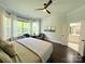 Spacious bedroom featuring a seating area by the windows and an ensuite bath at 11324 Fullerton Place Nw Dr, Huntersville, NC 28078