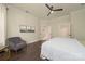 Large main bedroom with hardwood floors, opening into the ensuite bathroom at 11324 Fullerton Place Nw Dr, Huntersville, NC 28078