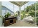 Relaxing porch with view of private fenced backyard and patio area at 11324 Fullerton Place Nw Dr, Huntersville, NC 28078