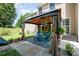 Inviting backyard patio area, perfect for outdoor dining and relaxation, with a charming garden view at 11802 Fox Glen Rd, Charlotte, NC 28269