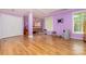 Large basement living space with bedroom area, and durable laminate flooring at 11802 Fox Glen Rd, Charlotte, NC 28269