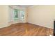 Bright, airy bonus room with wood floors and a large bay window for abundant natural light at 11802 Fox Glen Rd, Charlotte, NC 28269