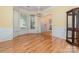 Spacious dining room area featuring wood floors, neutral paint and natural light at 11802 Fox Glen Rd, Charlotte, NC 28269