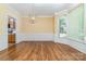 Inviting dining room with wood floors, and natural light; perfect for Gathering gatherings and entertaining at 11802 Fox Glen Rd, Charlotte, NC 28269