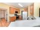 Functional kitchen featuring wood cabinets, white countertops, and stainless steel appliances at 11802 Fox Glen Rd, Charlotte, NC 28269