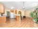 Bright kitchen with light wood cabinets, white countertops, and archway to living area at 11802 Fox Glen Rd, Charlotte, NC 28269