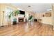 Spacious living room features a brick fireplace, wood floors and large windows for natural lighting at 11802 Fox Glen Rd, Charlotte, NC 28269