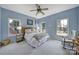 Comfortable bedroom with a wooden headboard and three bright windows at 1201 Beckford Glen Dr, Waxhaw, NC 28173