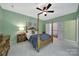 Bedroom with 4-poster bed, carpet, and a ceiling fan at 1201 Beckford Glen Dr, Waxhaw, NC 28173
