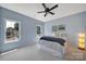 Cozy bedroom with carpeted floors, windows for natural light, and stylish decor at 1201 Beckford Glen Dr, Waxhaw, NC 28173