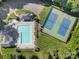 Overhead view showcasing a large community pool, with tennis courts nearby, and recreational facilities at 1201 Beckford Glen Dr, Waxhaw, NC 28173