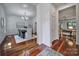 Inviting hallway with hardwood floors leading to a dining room and living room at 1201 Beckford Glen Dr, Waxhaw, NC 28173