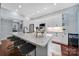 Bright kitchen with stainless steel appliances, granite countertops, and hardwood floors at 1201 Beckford Glen Dr, Waxhaw, NC 28173