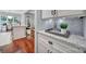 Kitchen counter with granite countertops, white cabinetry and a view into the dining area at 1201 Beckford Glen Dr, Waxhaw, NC 28173