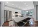 Modern kitchen featuring stainless steel appliances, a large island with seating, and stylish finishes at 1201 Beckford Glen Dr, Waxhaw, NC 28173