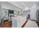 Open-concept kitchen with an island, granite countertops, and a view of the living room at 1201 Beckford Glen Dr, Waxhaw, NC 28173