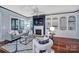 Comfortable living room with fireplace, built-in bookshelves, and plenty of natural light at 1201 Beckford Glen Dr, Waxhaw, NC 28173