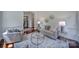 Bright living room with a decorative rug, comfortable seating, and stylish accents at 1201 Beckford Glen Dr, Waxhaw, NC 28173
