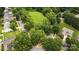 Stunning aerial view of a residential area featuring lush green trees and well-maintained homes at 13528 Philip Michael Rd, Huntersville, NC 28078