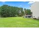 Home boasting a spacious and lush green backyard, with a patio area for relaxing and entertaining at 13528 Philip Michael Rd, Huntersville, NC 28078