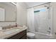 Bright bathroom featuring a shower and bathtub combo, marble-style vanity, and a modern fixture at 13528 Philip Michael Rd, Huntersville, NC 28078