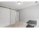 Bedroom with a sliding barn door providing separation to a closet or bath area at 13528 Philip Michael Rd, Huntersville, NC 28078